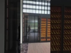 Full-Wall Stainless Steel Wine Cabinet With Storage And Seating In Elegant Black