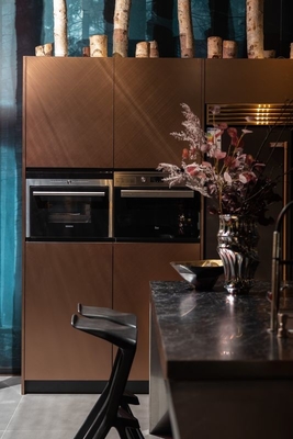 Rose Gold Modern Kitchen Cabinet With Geometric Lines And Stainless Steel Durability
