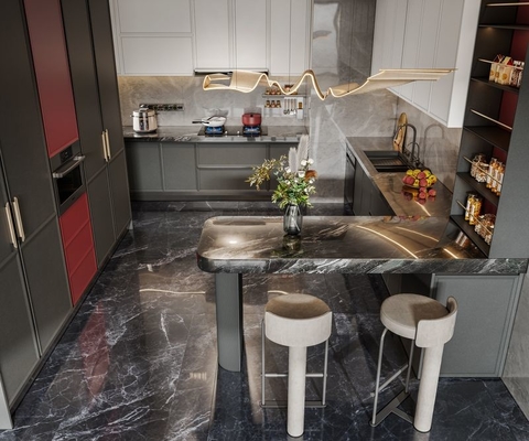 Modern Stainless Steel Kitchen Cabinet With Blush Red Accent And Extended Sinstered Stone Island